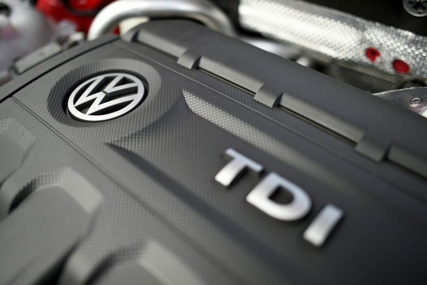 The engine of a diesel car bears a Volkswagen logo.
