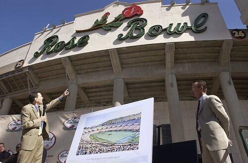 HOK architect Jon Knight, left, unveiled plans for a Rose Bowl renovation in 2003. Although the plan called for keeping the historic aspects of the stadium intact, including the original neon sign at the south entrance, the Rose Bowl Operating Co. never got the project off the ground.