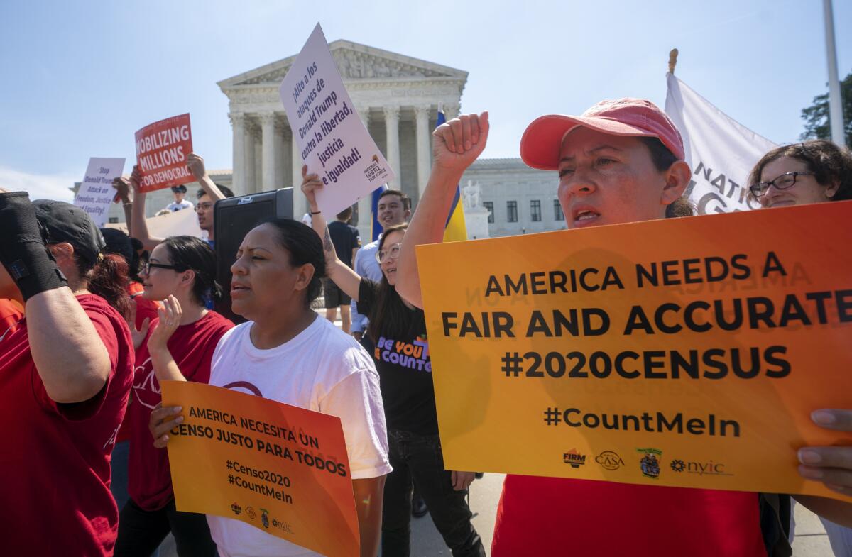 Demonstrators gather outside the Supreme Court on June 27 awaiting a decision on the Trump administration's attempt to add a citizenship question to the 2020 census.
