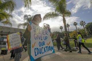 LONG BEACH, CA - NOVEMBER 20, 2019 -- Students, parents and community members rally outside of a California State University board of trustees meeting to protest a proposal that would require students to complete an additional year of math, science or other quantitative coursework in order to gain admission. (Irfan Khan / Los Angeles Times)