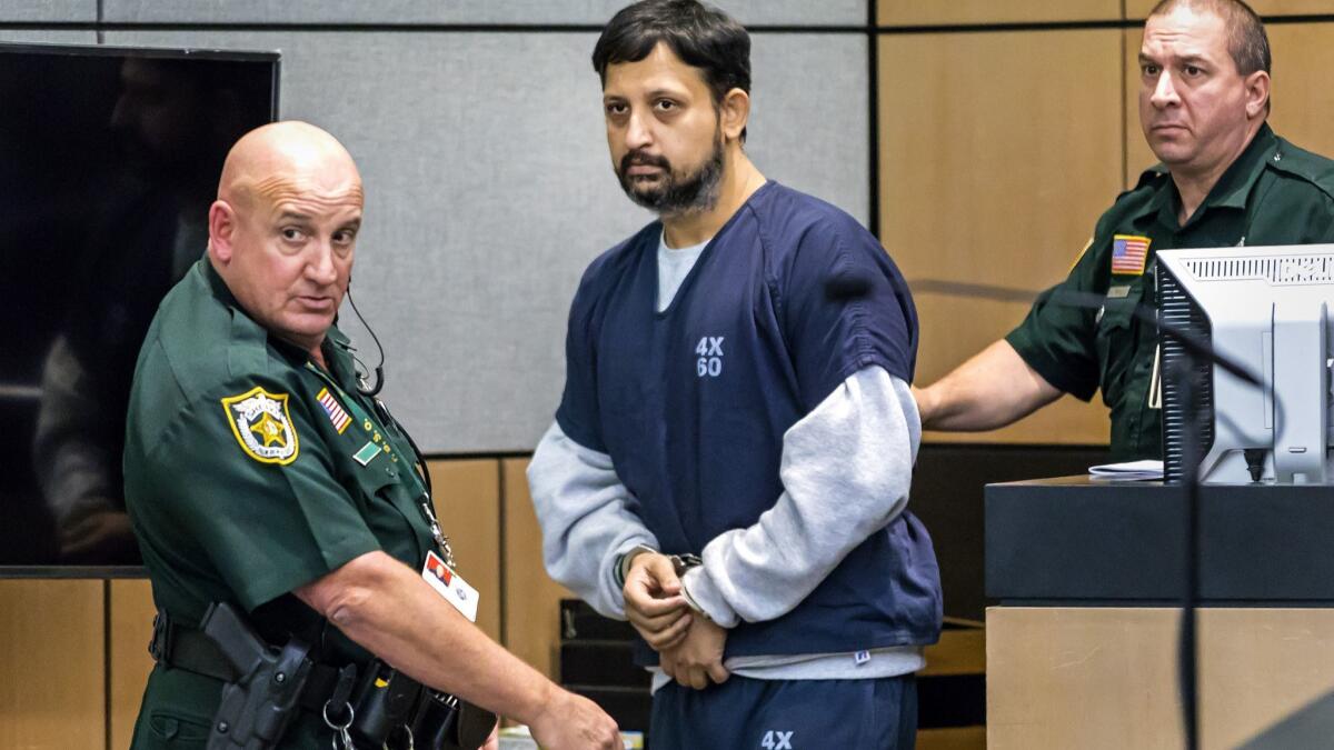 Former Florida police officer Nouman Raja is brought into the courtroom for sentencing Thursday in West Palm Beach.