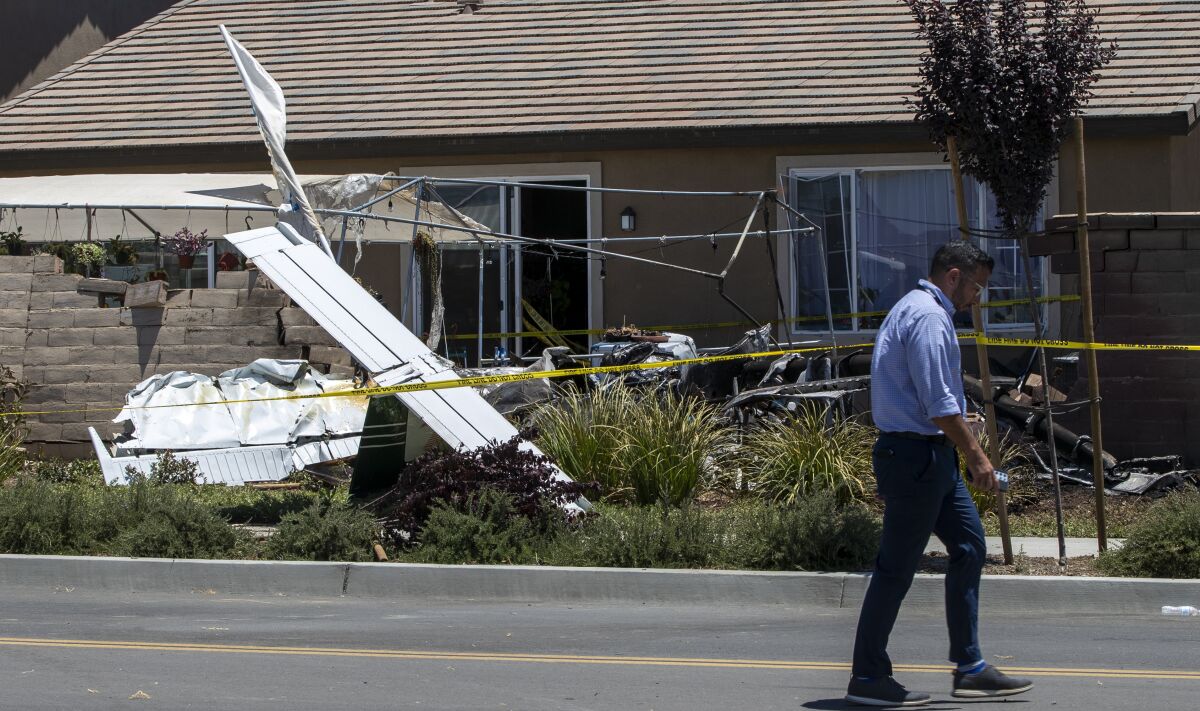 Wreckage of a small plane in a yard of a home in Hemet