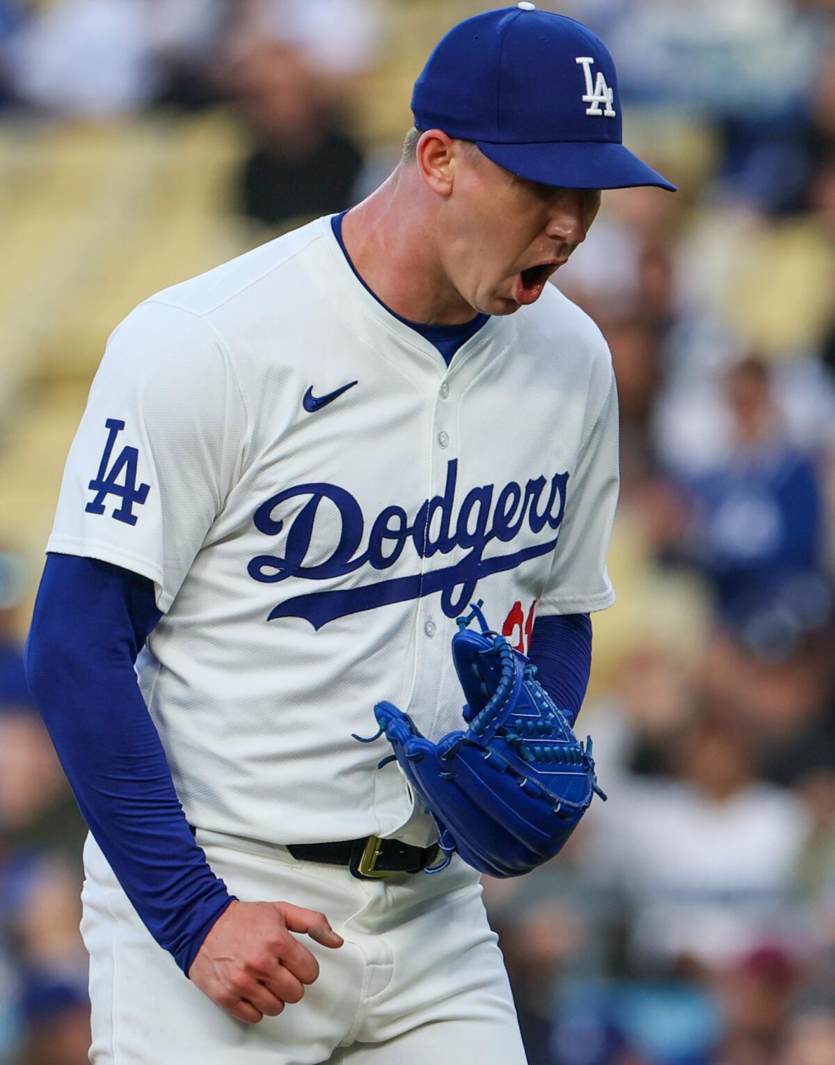 Dodgers starting pitcher Walker Buehler reacts after striking out Colorado's Brendan Rodgers.