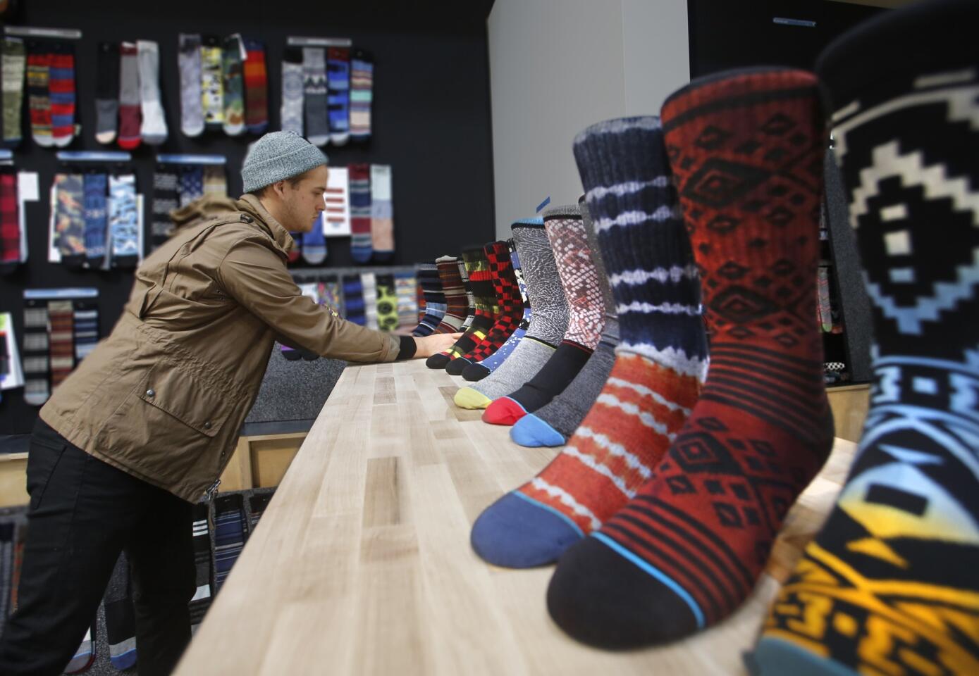 Stance is a designer sock company in San Clemente. And the way Chief Executive Jeff Kearl sees it, creativity is the key to the company's success in the competitive retail marketplace. He and the company's co-founder set out to create a workspace that would feed his employees' creative energy. Here's a behind-the-scenes look at that endeavor. The difference is clear, right at the front door. There are no suits and ties, no stodgy cubicles. Employees are encouraged to dress in whatever manner suits the duties for the day. Here, product designer Dillon Boyes works on a prototype display.