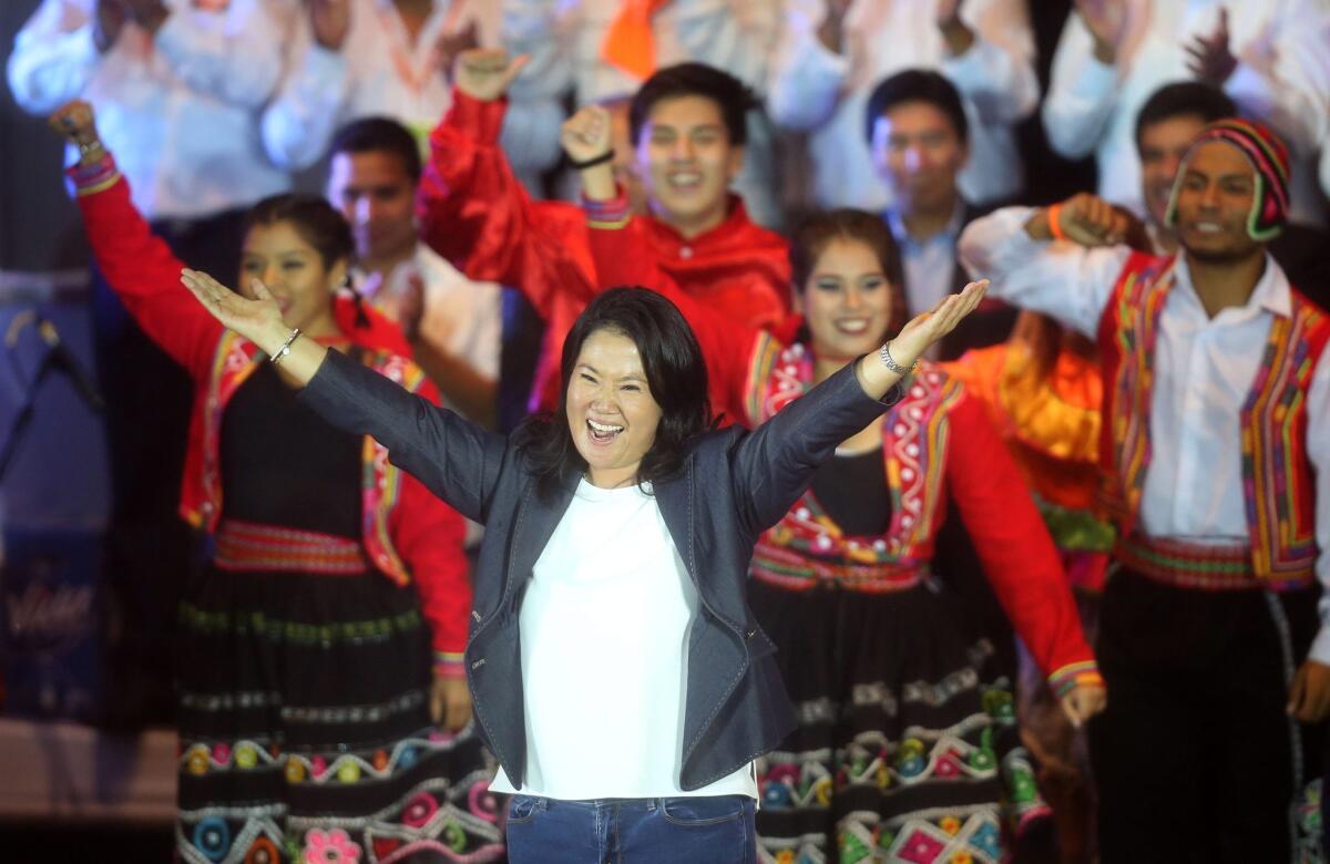 Peruvian presidential candidate Keiko Fujimori greets her supporters during a campaign event in Lima. Peruvians will go to the polls Sunday to decide a runoff between Fujimori and Pedro Pablo Kuczynski.