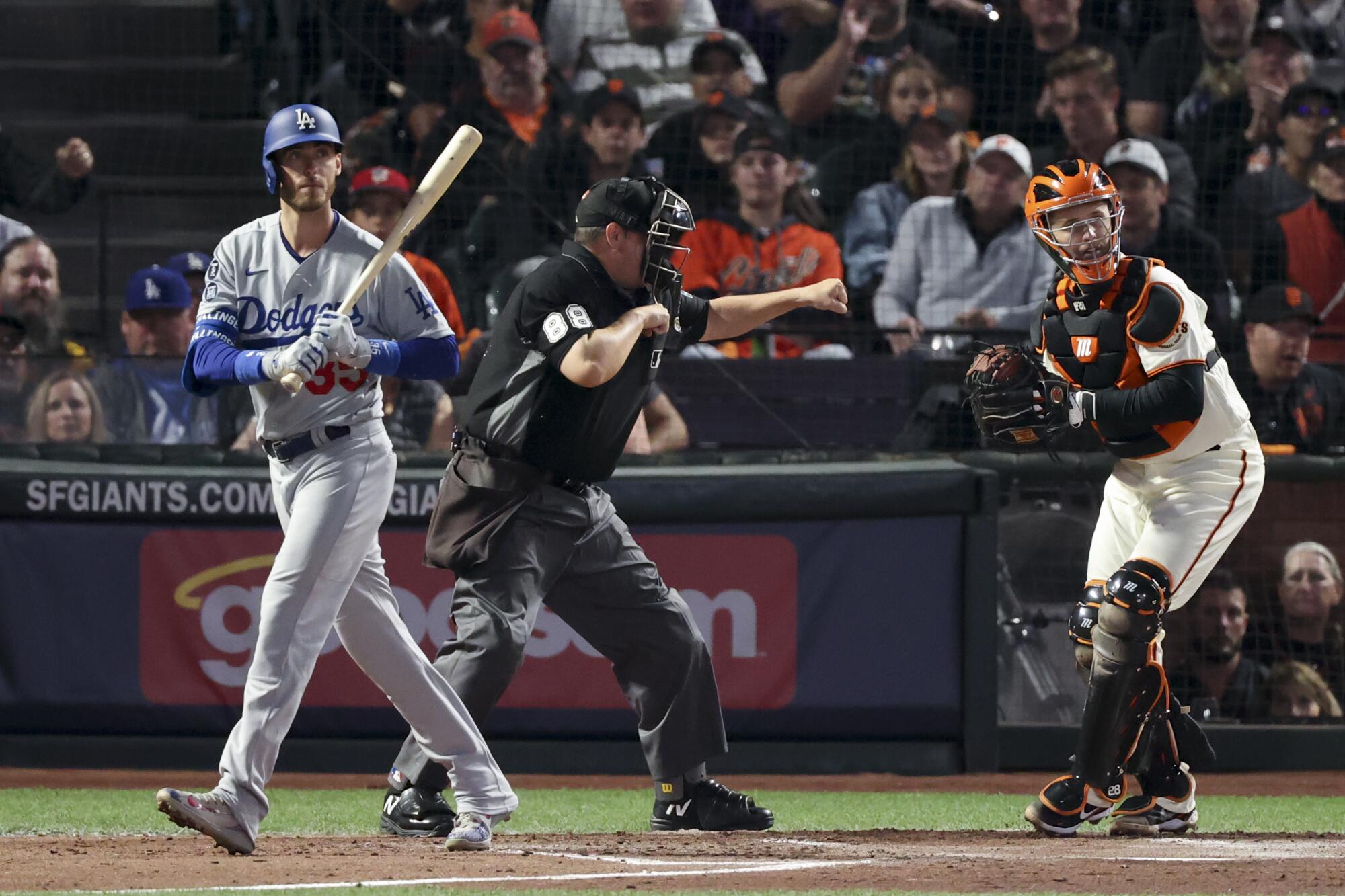 The Dodgers' Cody Bellinger walks out of the batter's box.