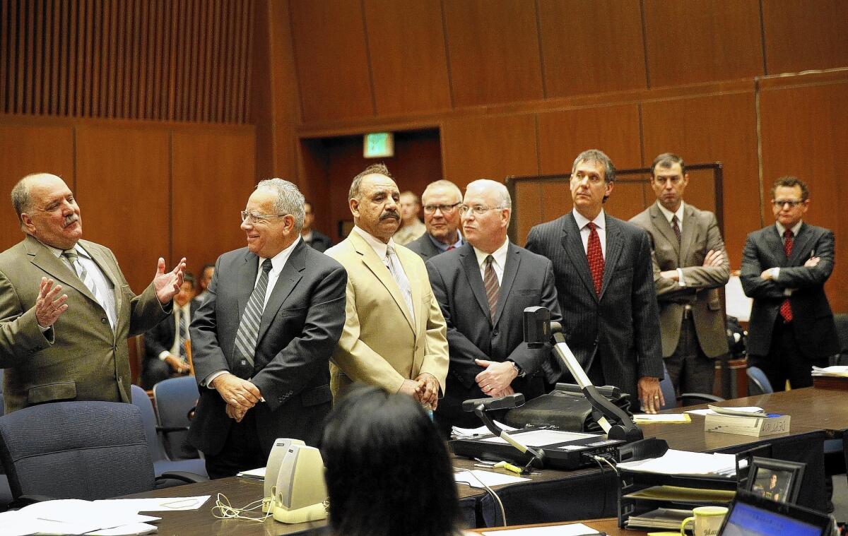 Five former Bell council members -- including Victor Bello, left -- and their attorneys appear in Los Angeles County Superior Court. The defendants pleaded no contest to misappropriating public funds.