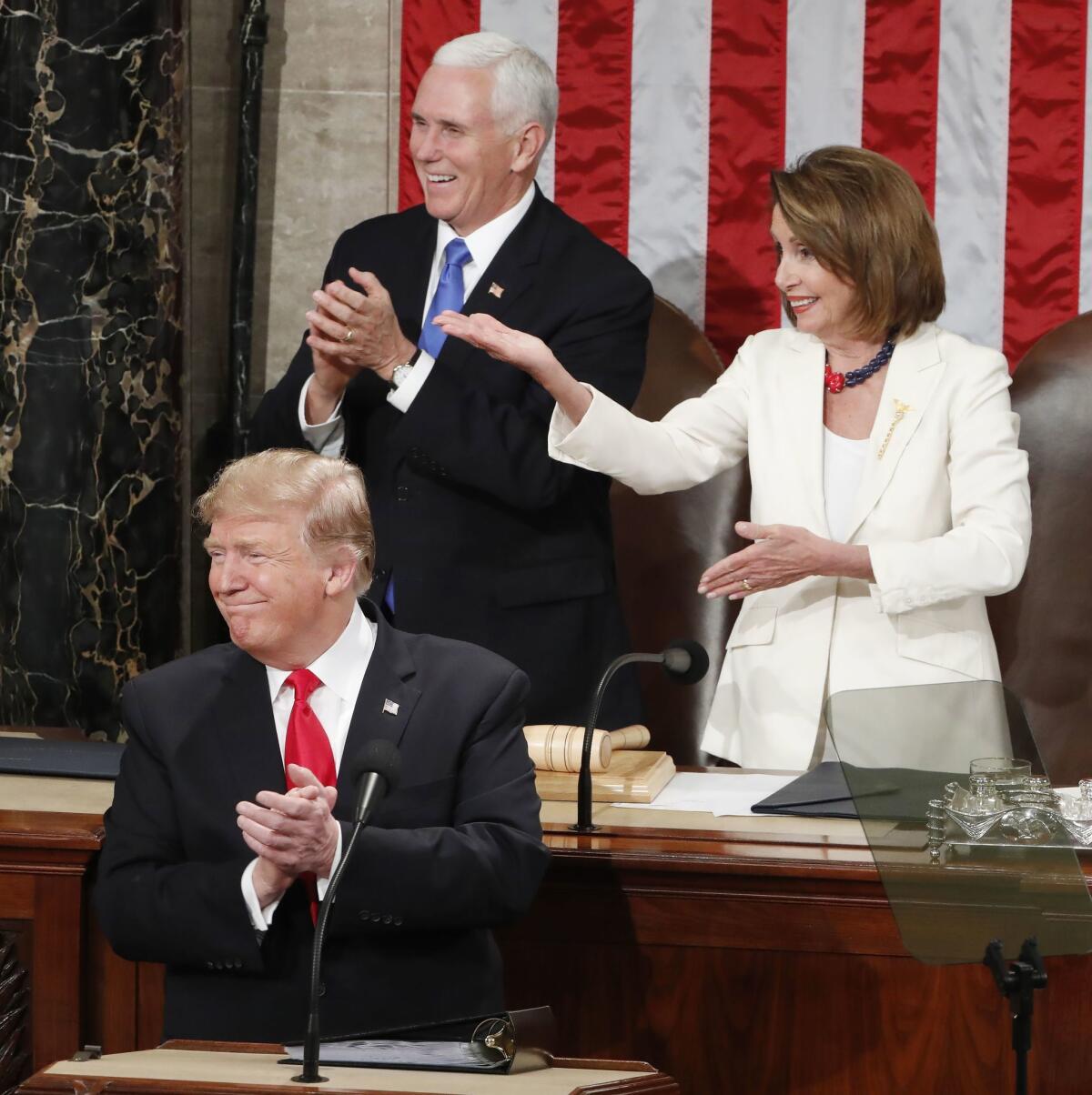 Vice President Mike Pence, clockwise, and Speaker of the House Nancy Pelosi react as President Trump delivers his second State of the Union address from the floor of the House of Representatives at the Capitol in Washington D.C.