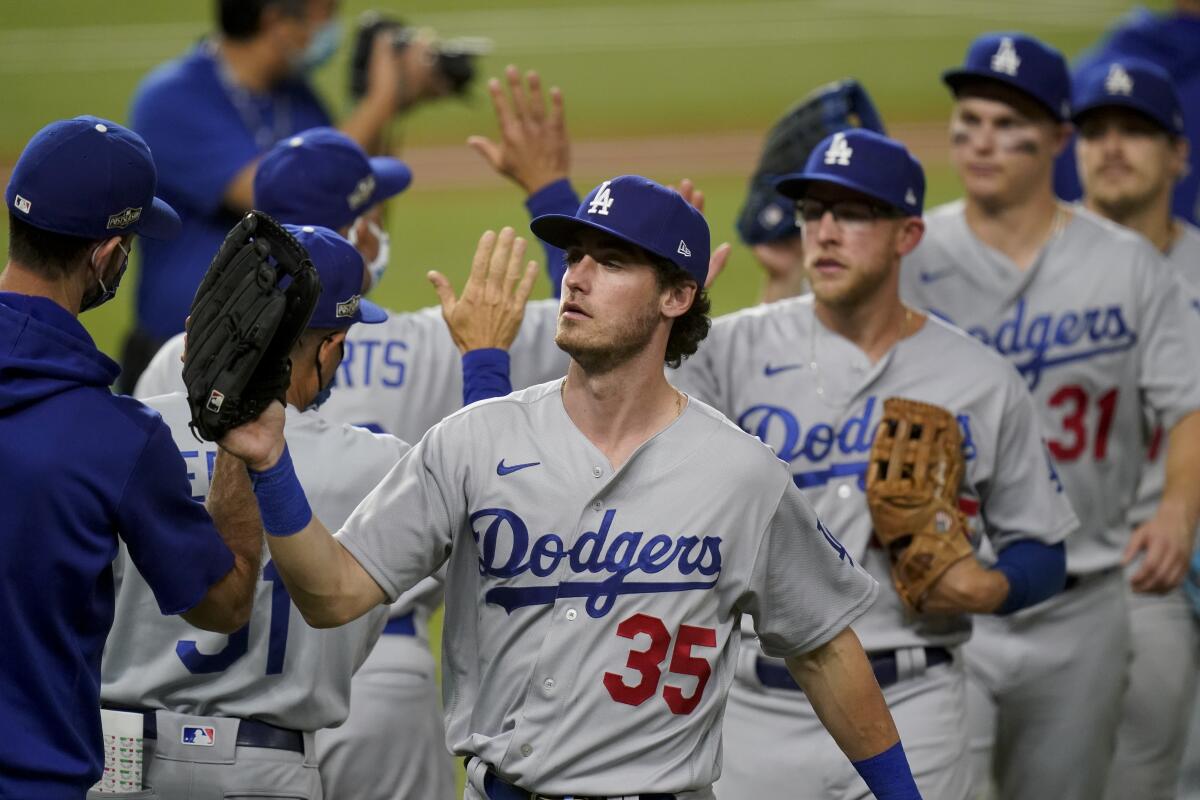 Dodgers players celebrate their win over the Atlanta Braves in Game 3 of the NLCS on Wednesday.