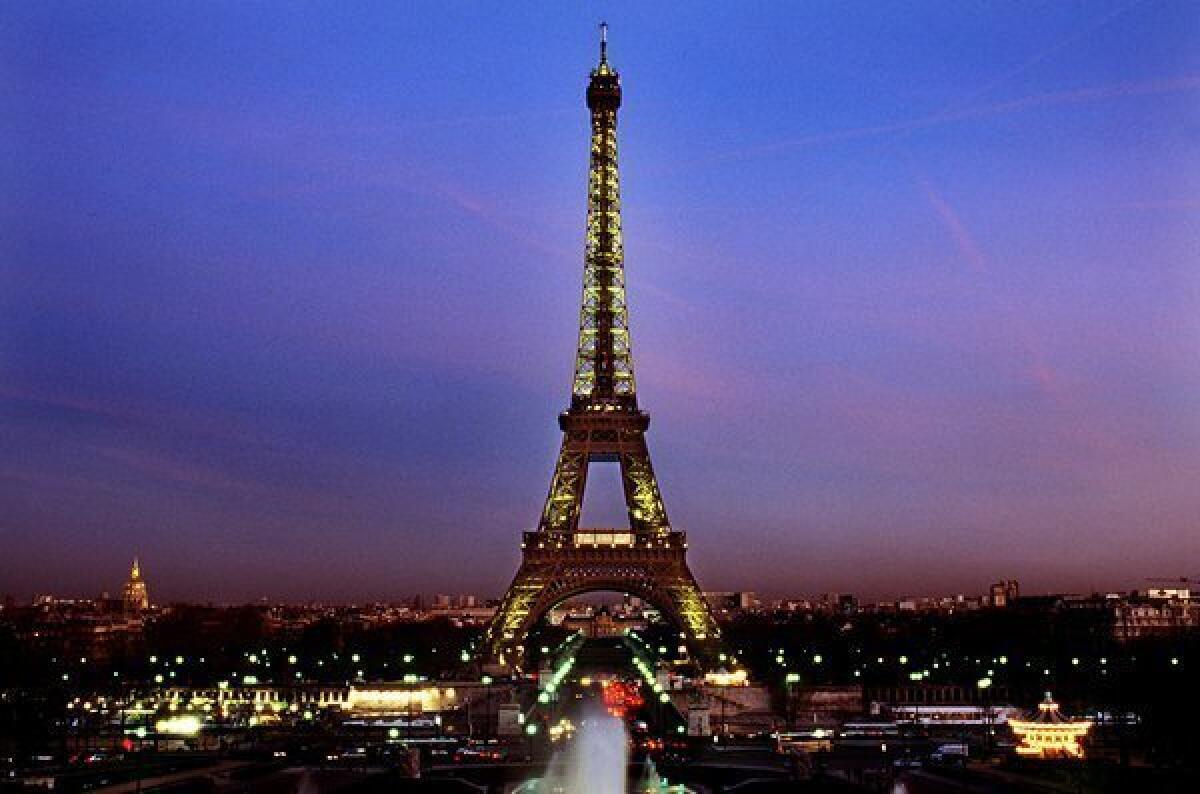 A view of Paris at twilight. Under new regulations, the city may be left in the dark late at night to save money.