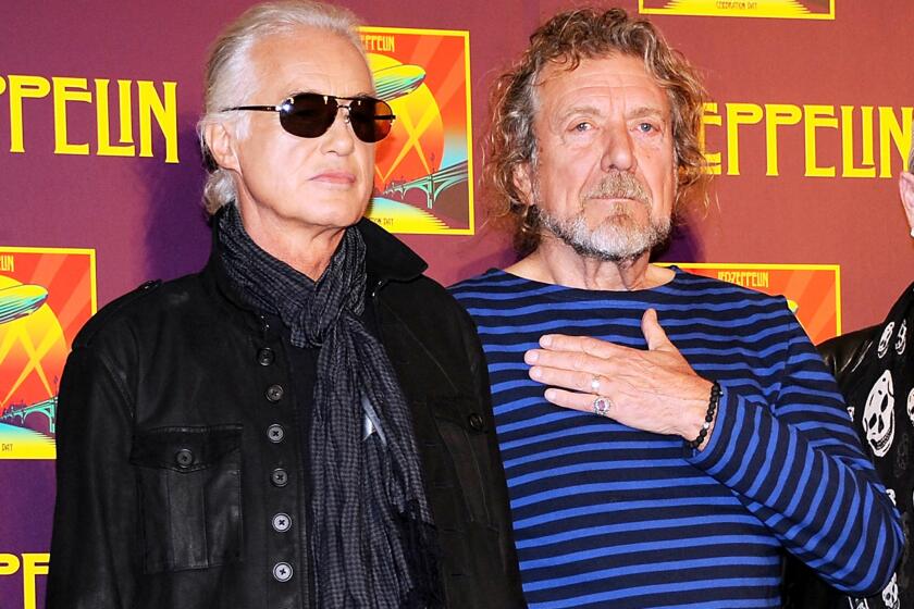 Jimmy Page, left, and Robert Plant appear at a news conference in London in 2012.