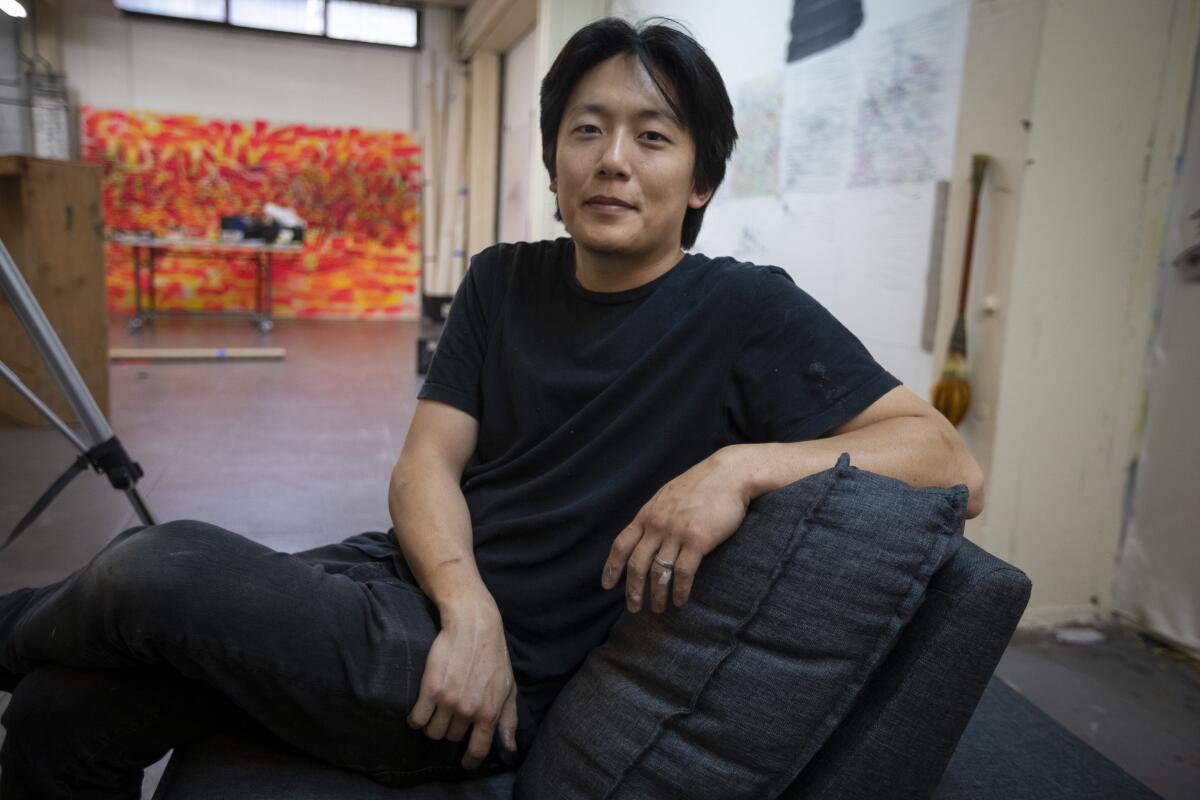 Artist Duke Choi, 30, in his space at Santa Fe Art Colony.
