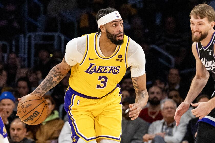 LOS ANGELES, CA - MARCH 6, 2024: Los Angeles Lakers forward Anthony Davis (3) brings the ball up.