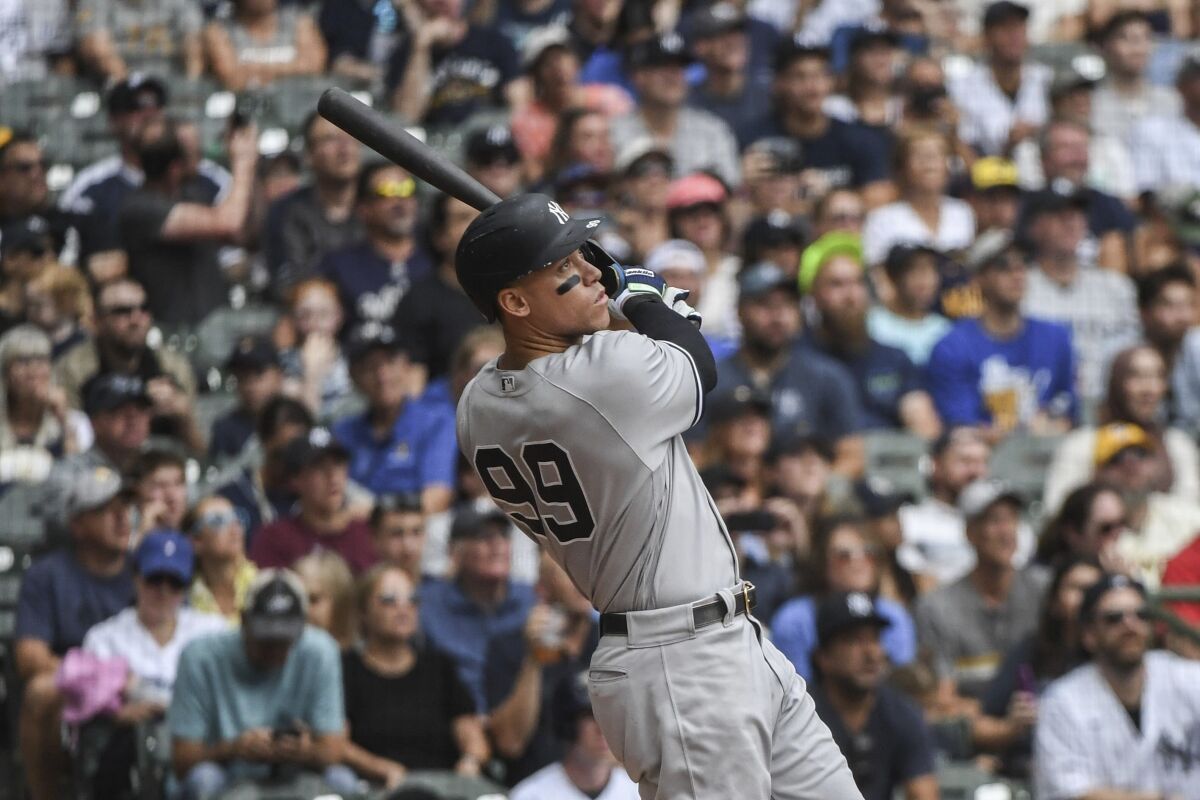 Yankees star Aaron Judge hits his 58th homer of the season against the Milwaukee Brewers on Sunday.