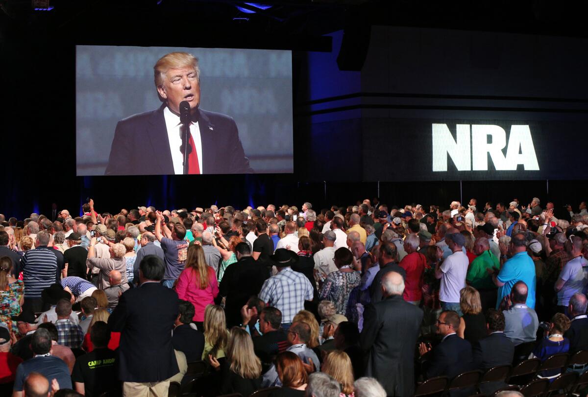 Thousands watch President Trump deliver the keynote address at a National Rifle Assn. meeting in Atlanta in April 2017.