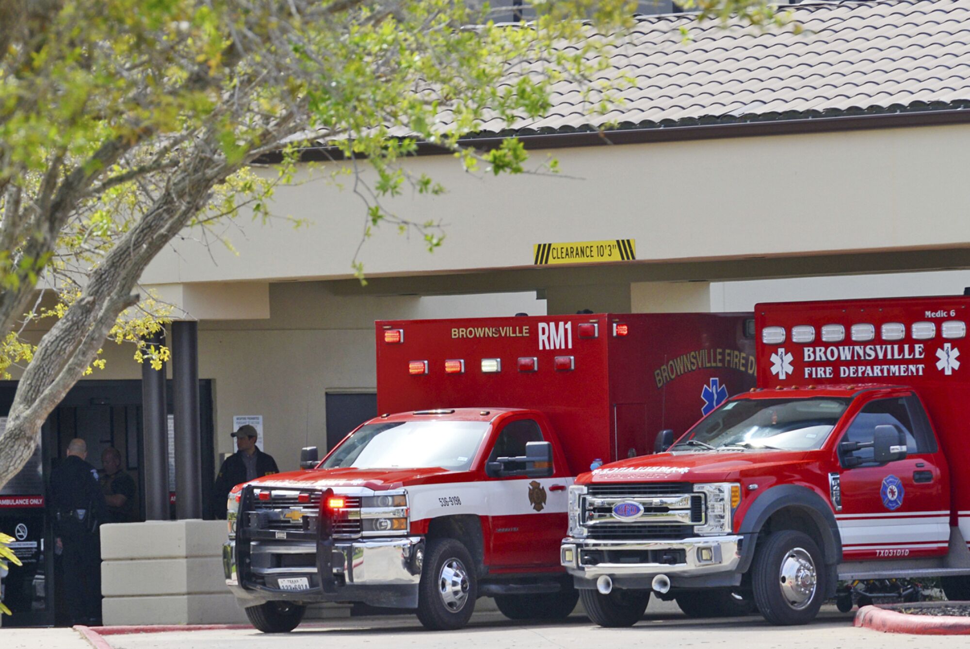 Two ambulances parked near a building 