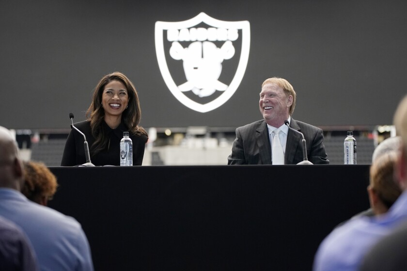 Sandra Douglass Morgan, left, smiles with Las Vegas Raiders owner Mark Davis during a news conference announcing Morgan as the new president of the Raiders NFL football team Thursday, July 7, 2022, in Las Vegas. (AP Photo/John Locher)