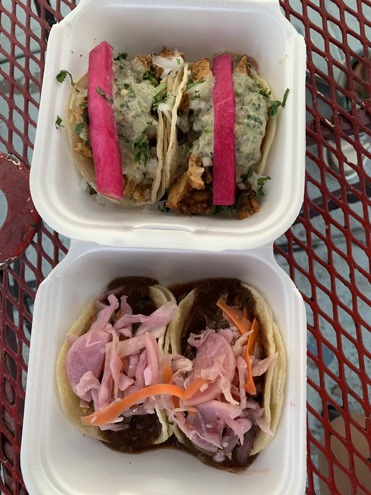 Overhead shot of a chicken shawarma and vegan falafel taco