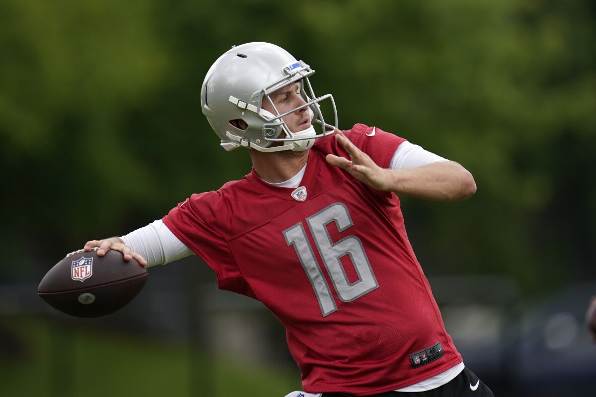 FILE - Detroit Lions quarterback Jared Goff throws during an NFL football practice in Allen Park, Mich., Thursday, May 26, 2022. Goff is behind a solid line with a good pair of running backs, a standout tight end and an improved receiving corps. (AP Photo/Paul Sancya, File)