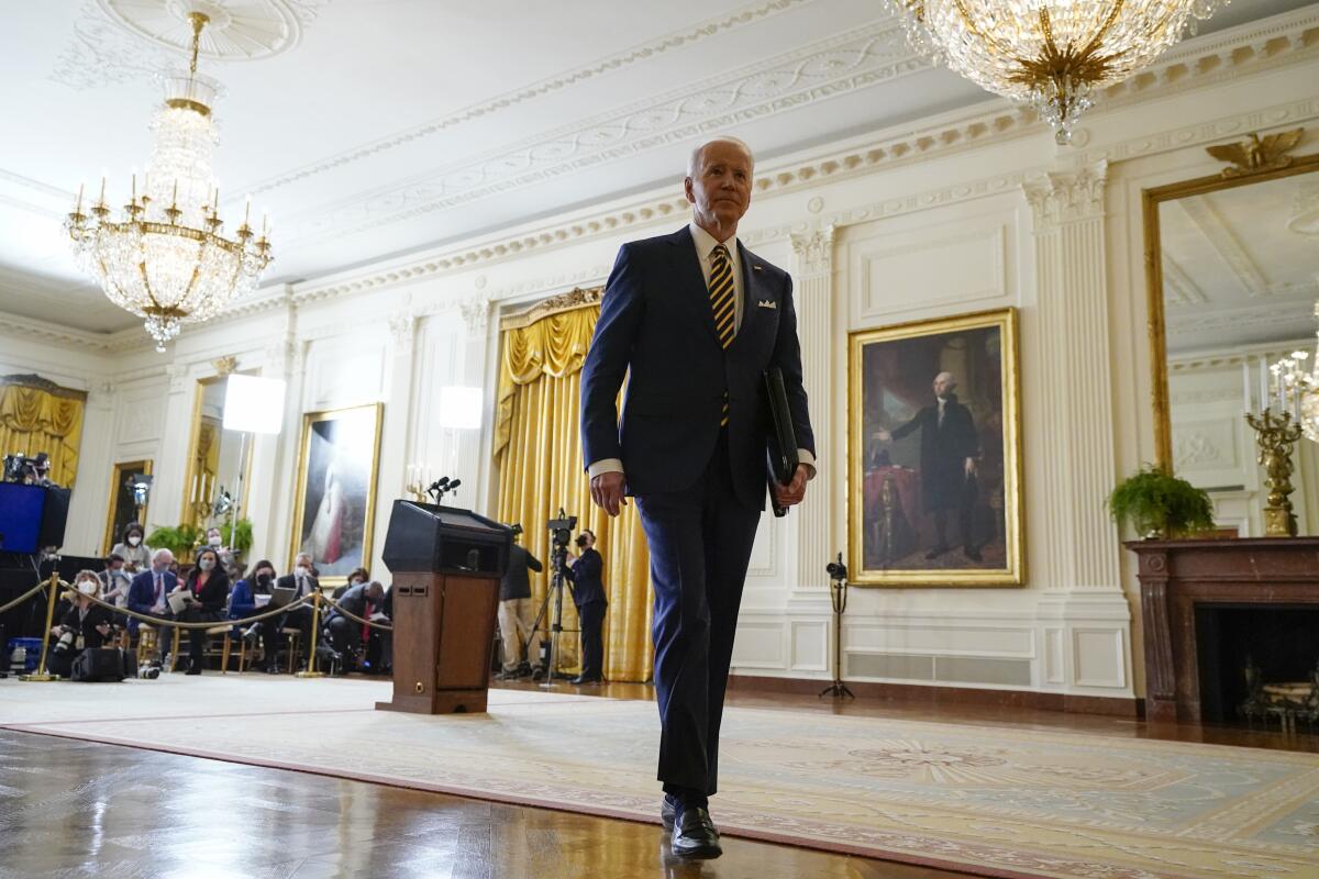 President Biden leaves after a news conference in the East Room of the White House in Washington on Wednesday.