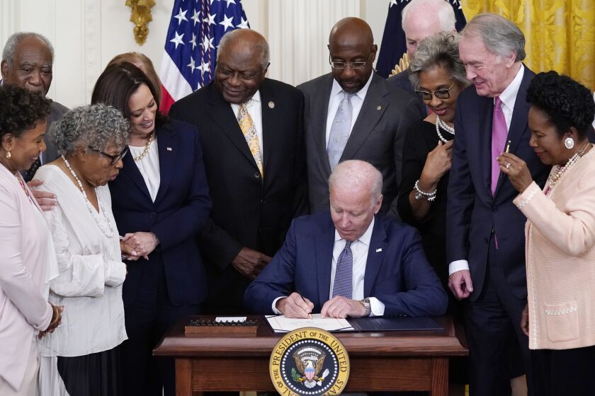 President Joe Biden signs the Juneteenth National Independence Day Act, in the East Room of the White House, Thursday, June 17, 2021, in Washington. (AP Photo/Evan Vucci)