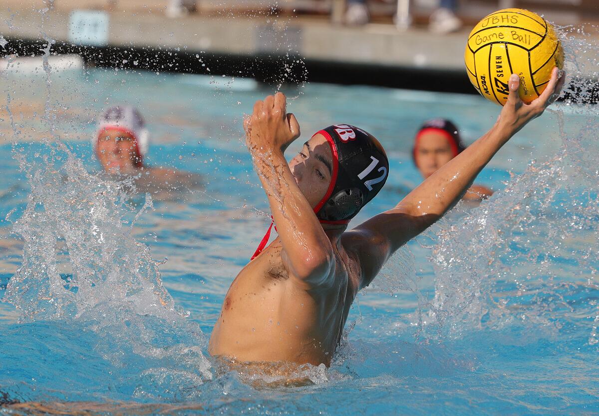 Burroughs' Vahagan Sahakyan leans back to shoot on Glendale in a Pacific League boys' water polo match at Burroughs High School on October 1, 2019. Glendale won the match 10-8.