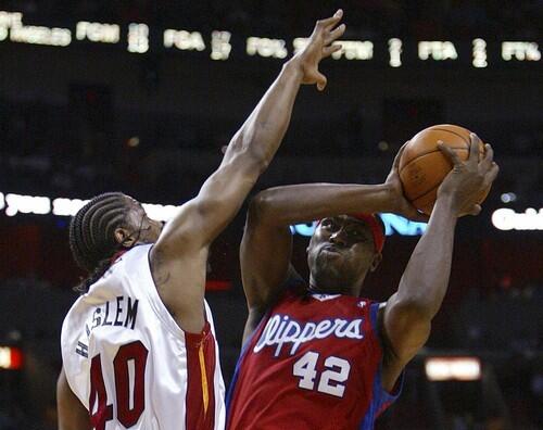 Clippers forward Elton Brand (42) attempts a shot past Miami Heat forward Udonis Haslem.