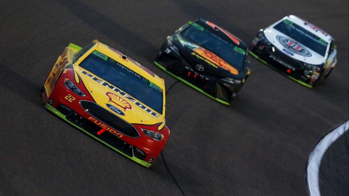 NASCAR driver Joey Logano leads Martin Truex Jr. and Kevin Harvick during the Monster Energy NASCAR Cup Series race Sunday at Homestead-Miami Speedway.