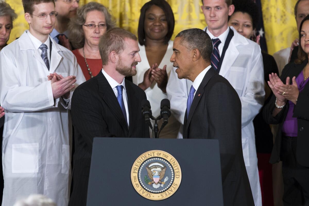 President Obama greets Ebola survivor Dr. Kent Brantly before giving an address Wednesday at the White House.