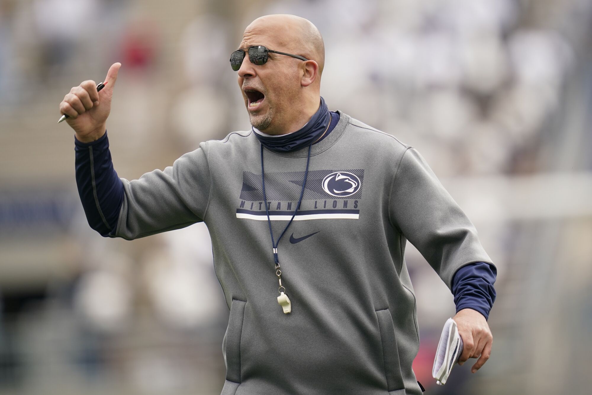 Penn State coach James Franklin shouts instructions to players during a practice