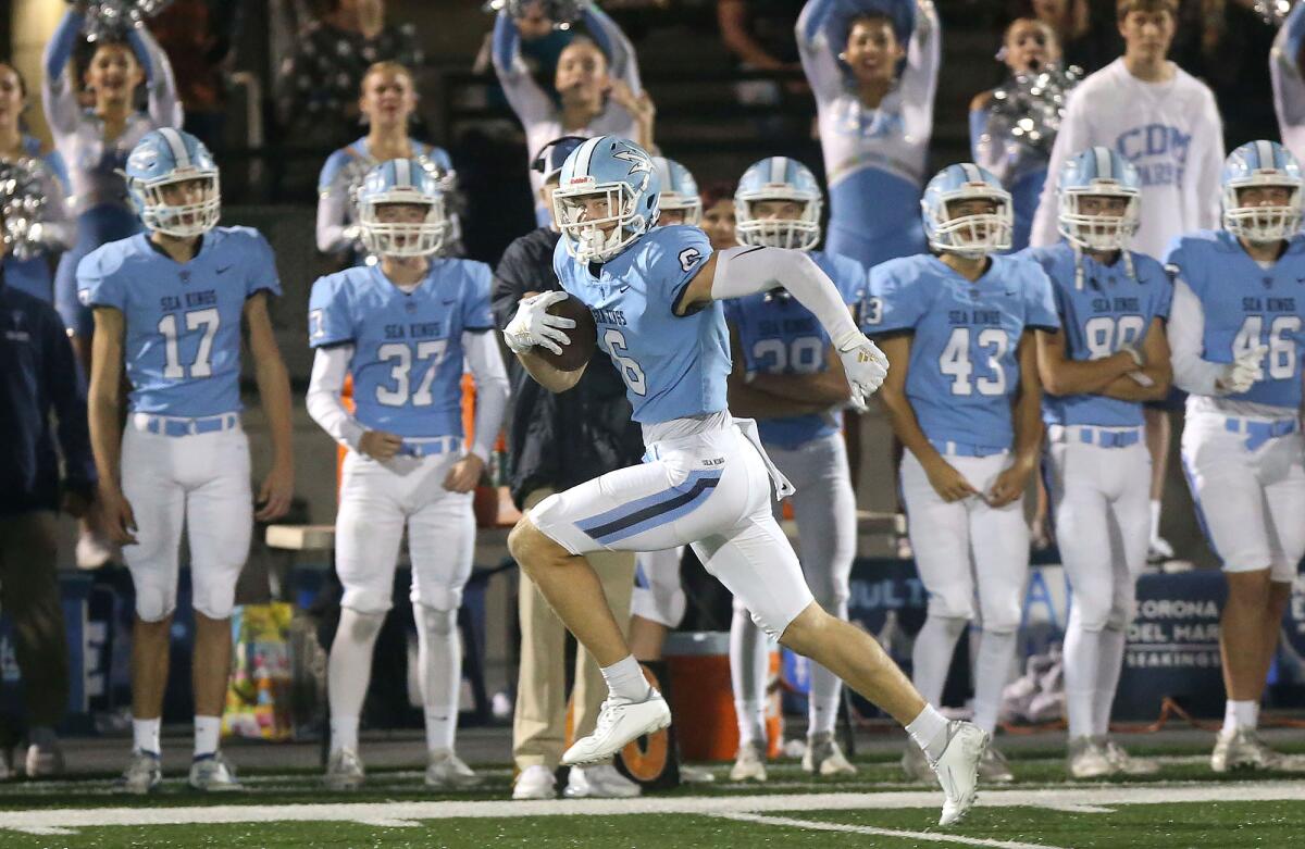 Corona del Mar wide receiver John Humphreys runs for the end zone after catching a pass during the quarterfinals of the CIF Southern Section Division 3 playoffs against Cajon on Saturday.