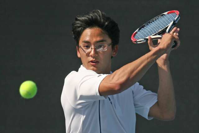 Corona del Mar's Joel Ishii goes to his backhand during Tuesday's match against Woodbridge.