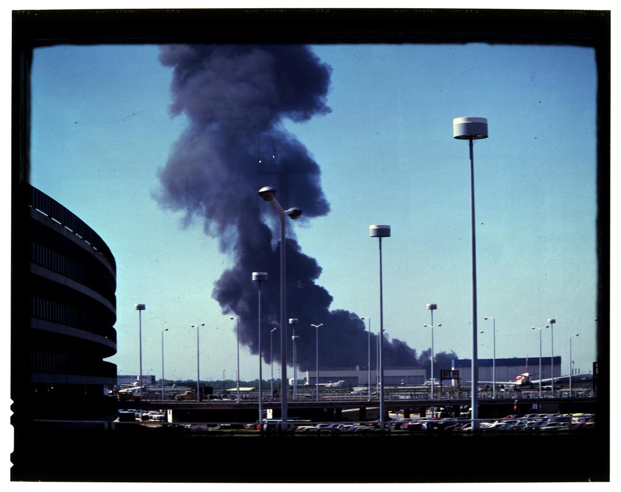 With its left engine missing, American Airlines Flight 191 goes into a severe roll, then crashes in a burst of flames less than a mile away from the runway in 1979. These photos were taken by Michael Laughlin, 24, a student pilot who was on a layover in the O'Hare terminal when he witnessed the tragedy.