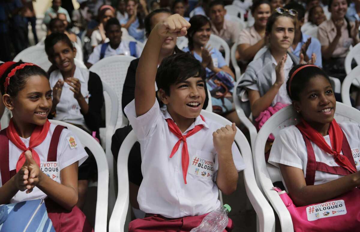 Students cheer after hearing the United Nations vote result on the Cuba embargo resolution, in Havana, Cuba on Wednesday.