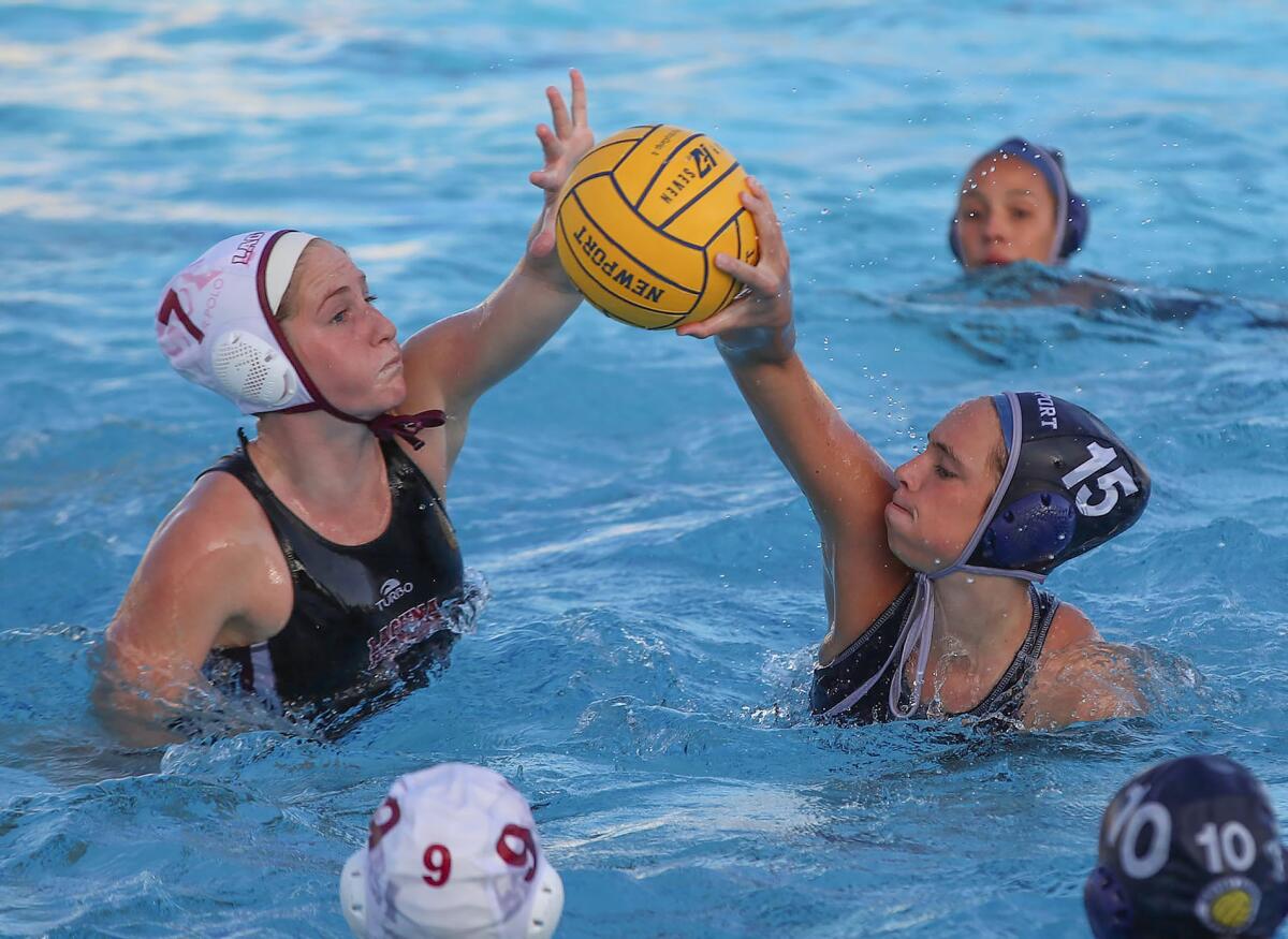 Laguna's Kara Carver (7) blocks a pass by Newport Harbor's Kylie Robison during Tuesday's key Surf League match.