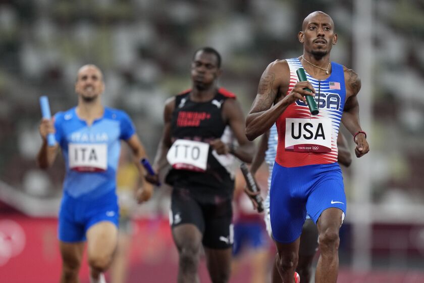 U.S. athlete Vernon Norwood competes in a heat of the men's 4x400-meter relay 