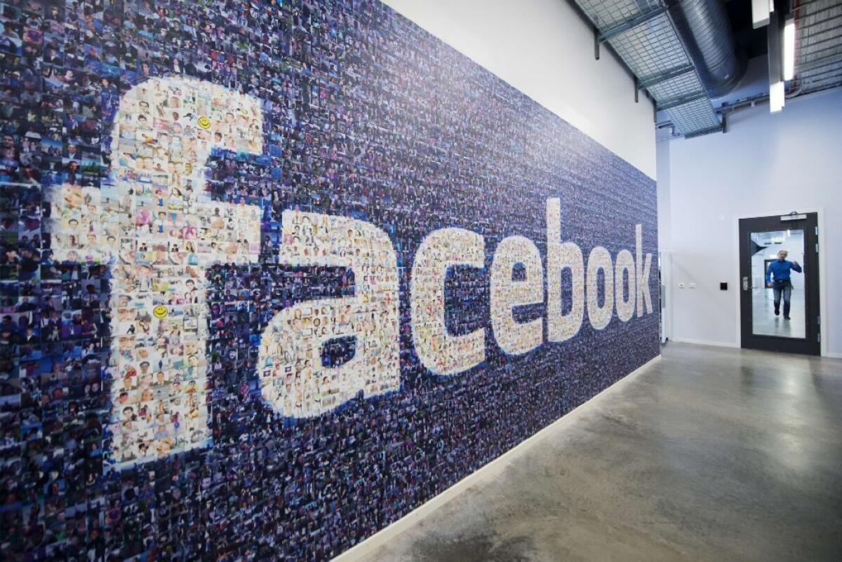 A logo created from pictures of Facebook users is on display at the company's data center in Sweden.