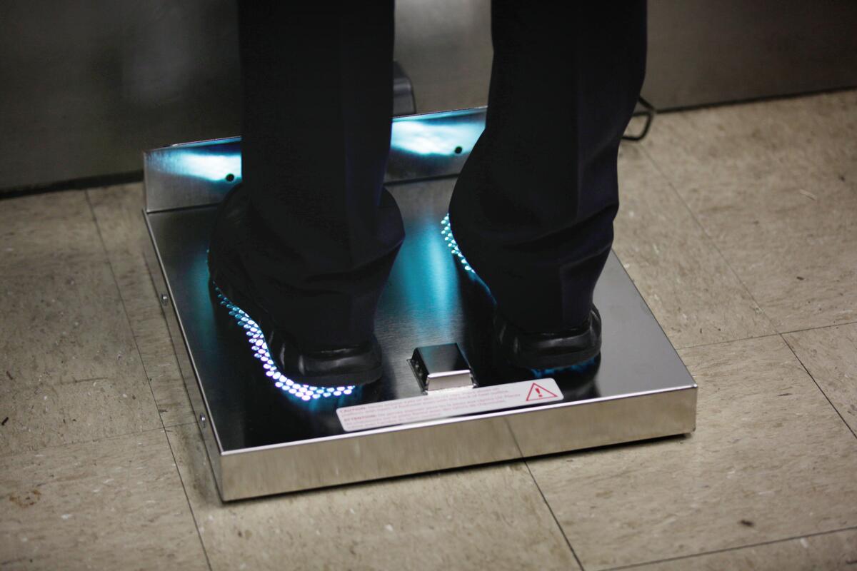HealthySole, a $5,000 footwear sanitizer, in use at the LAPD's Central Division station.