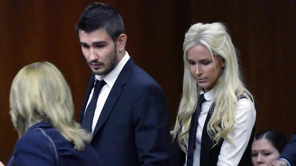 Slava Voynov enters Superior Court with his wife, Marta Varlamova, on July 2, 2015.
