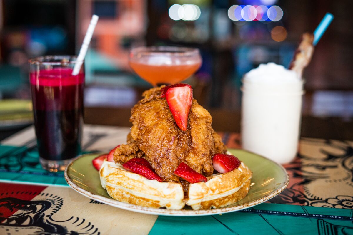 Chicken and Waffles are on the brunch menu at Punch Bowl Social.