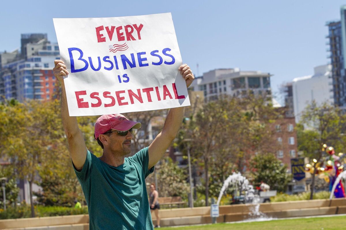 A man takes part in a "Liberate San Diego" protest in April.