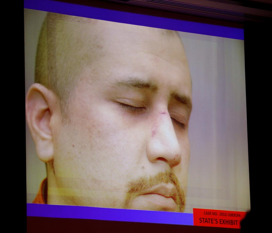 State exhibit photos, including this of George Zimmerman on the night of the Trayvon Martin shooting, are projected in court during the 15th day of Zimmerman's trial in Seminole circuit court, in Sanford, Fla., Friday, June 28, 2013. Zimmerman is accused in the fatal shooting of Trayvon Martin. (Joe Burbank/Orlando Sentinel/POOL) newsgate CCI B583027229Z.1