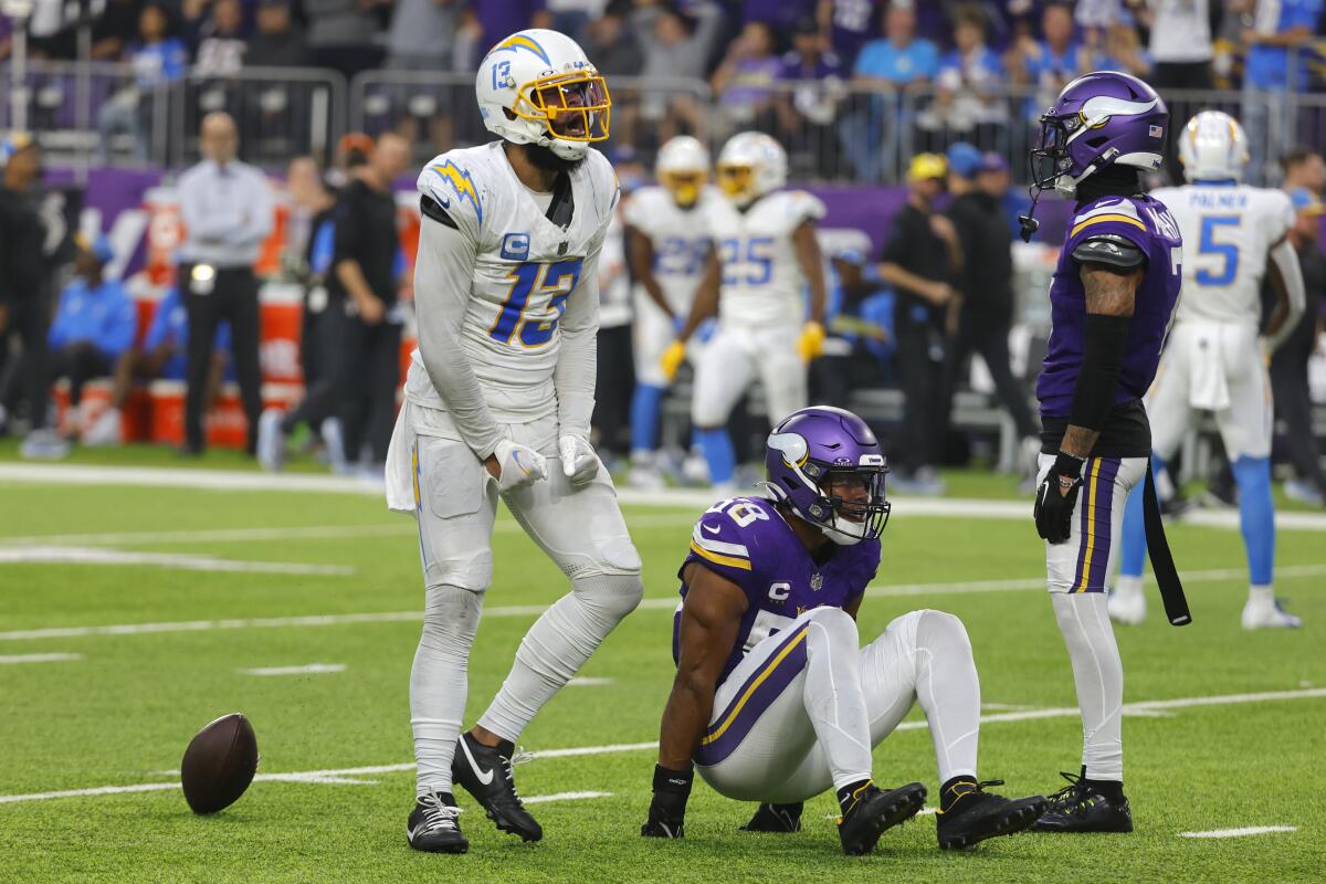 Chargers receiver Keenan Allen (13) celebrates after catching a pass.in front of  Vikings linebacker Jordan Hicks (58). 