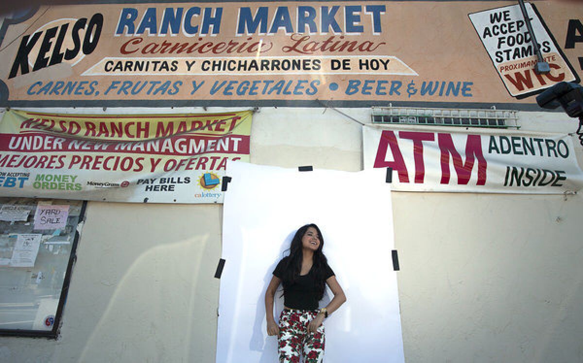 Becky G stops for a photo outside Kelso Ranch Market, located a few blocks from her grandmother's home in Inglewood.