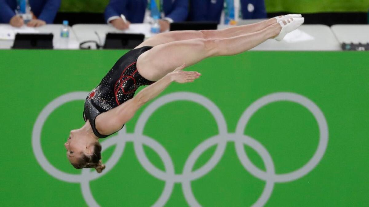 Rosie MacLennan of Canada soars through the air during the women's trampoline final at the 2016 Summer Games in Rio de Janeiro.