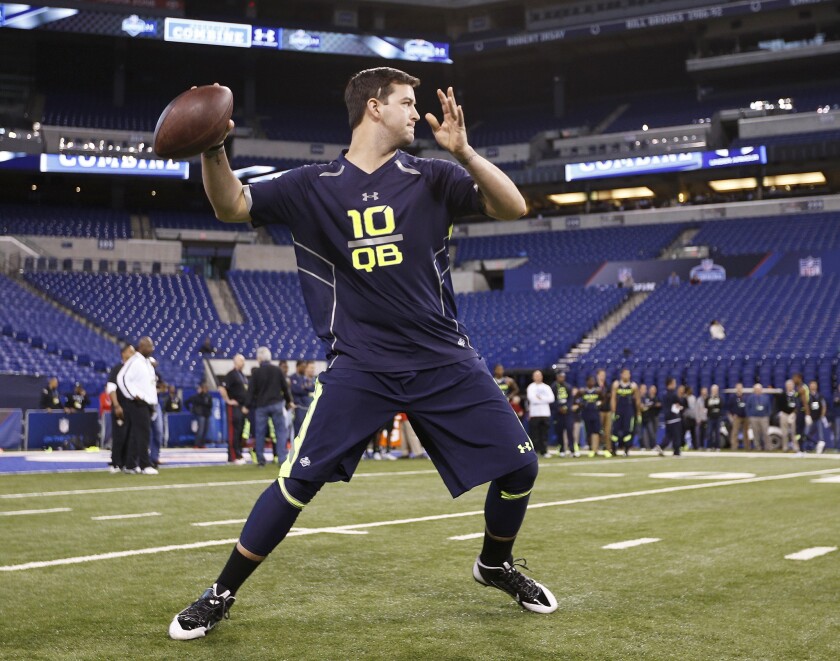 Former Alabama quarterback AJ McCarron works out during the NFL Combine at Lucas Oil Stadium in Indianapolis.