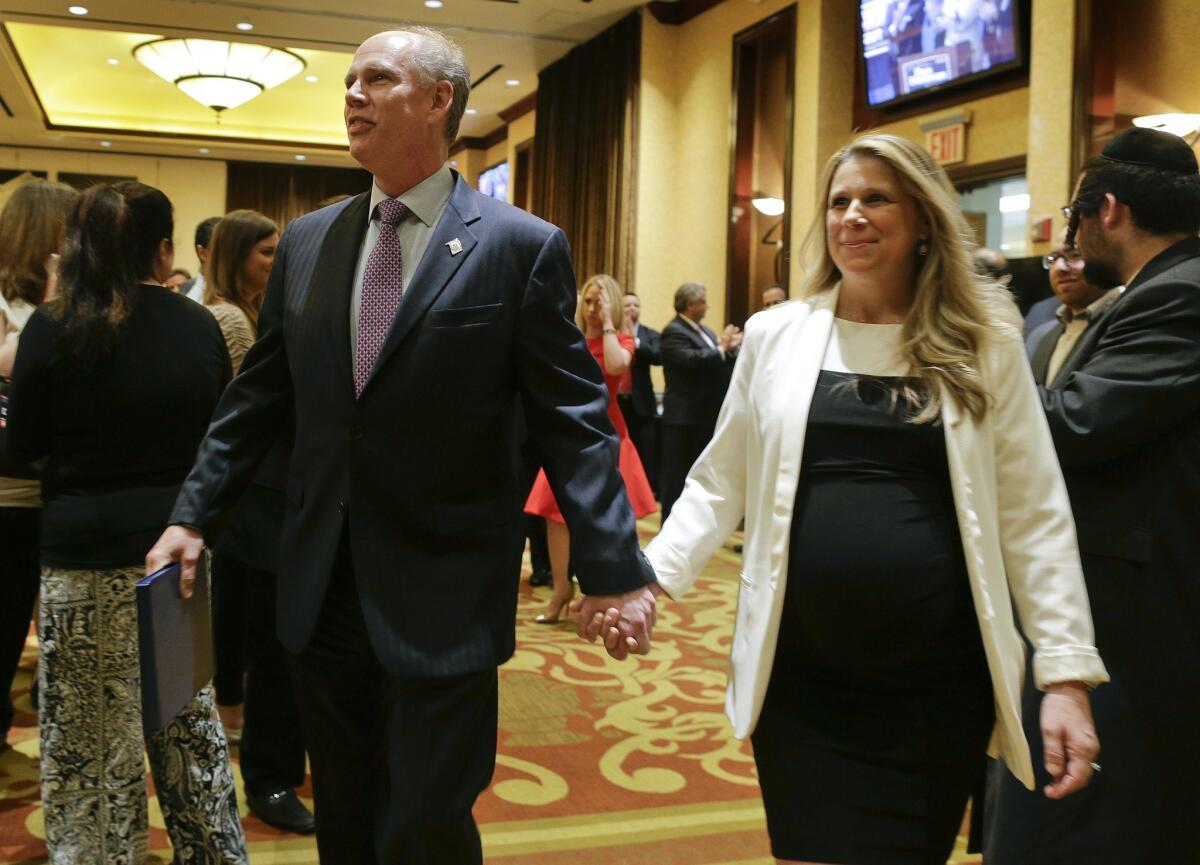 Accompanied by his fiancee, Serena Stonick, Dist. Atty. Dan Donovan arrives at an election night gathering Tuesday in the Staten Island borough of New York City.