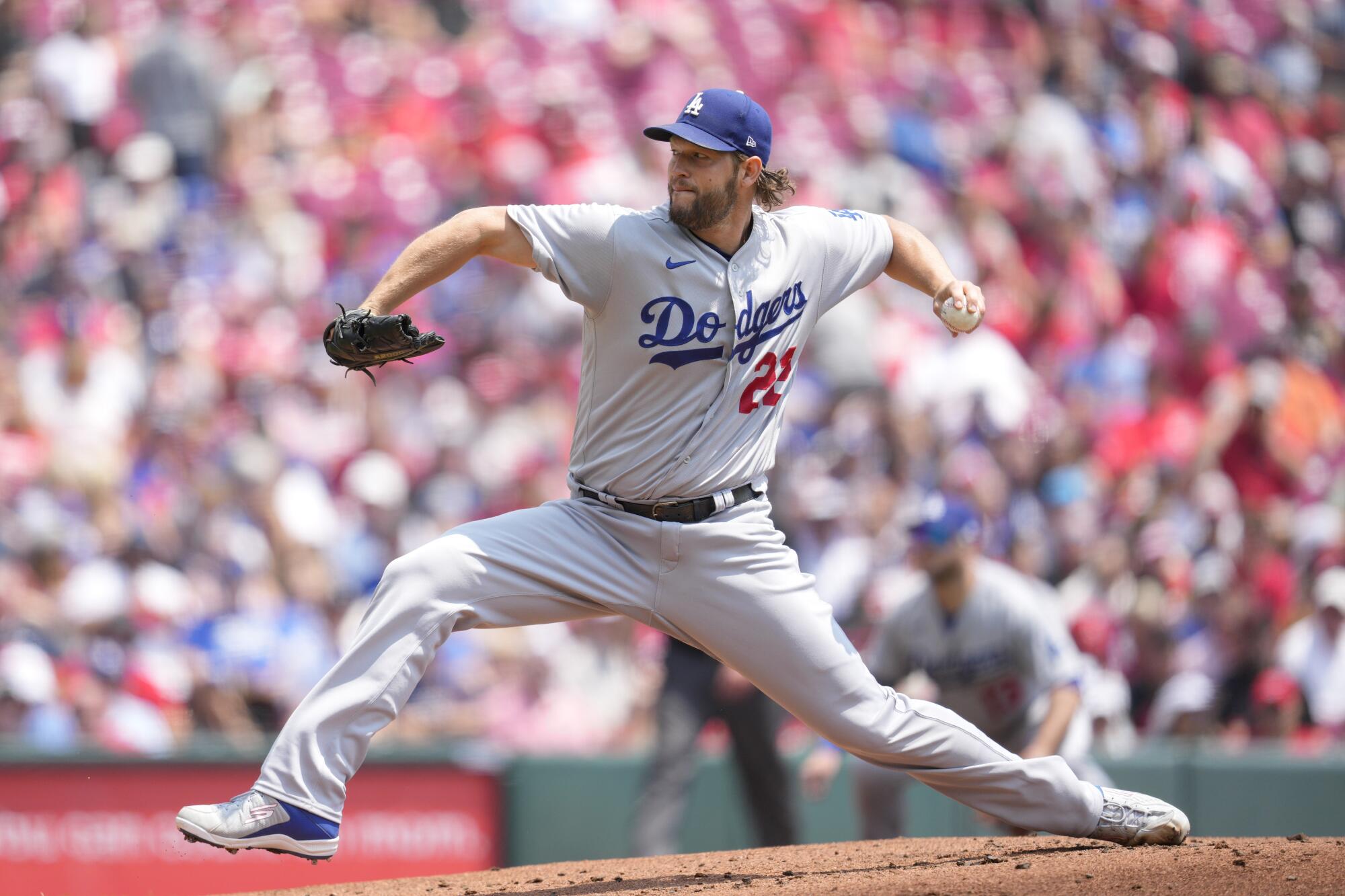 Dodgers starting pitcher Clayton Kershaw delivers during the first inning against the Reds.