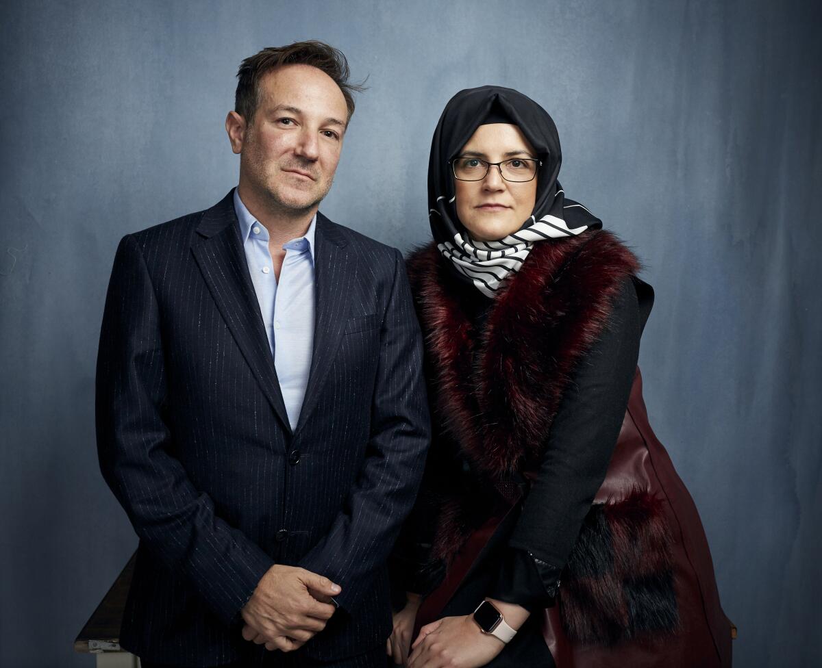FILE - Director Bryan Fogel, left, and Hatice Cengiz pose for a portrait to promote "The Dissident," a film about slain journalist Jamal Khashoggi, during the Sundance Film Festival in Park City, Utah on Jan. 24, 2020. (Photo by Taylor Jewell/Invision/AP, File)