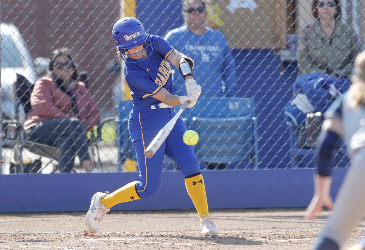 Fountain Valley's Taylor Reynolds hits a single to advance a runner to second during a Wave League softball game on Tuesday.
